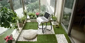 A cozy balcony with artificial grass,