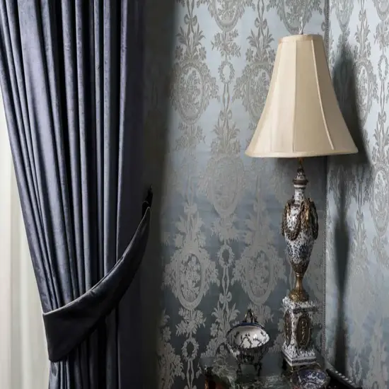 A cozy corner featuring elegant blue curtains