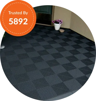 Black checkered patio mat with potted plant