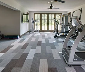 Bright home gym featuring various exercise equipment