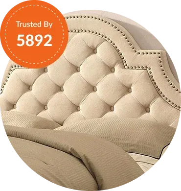 Elegant tufted beige headboard with decorative nailhead trim
