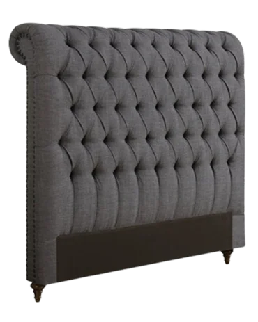 Gray tufted upholstered headboard with a rolled top and a dark upholstered base