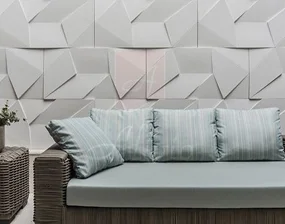 Modern lounge area featuring a textured 3D wall