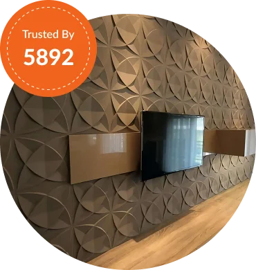Modern wall design with geometric patterns, featuring a flat-screen