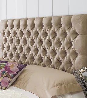Textured beige upholstered headboard with tufted design
