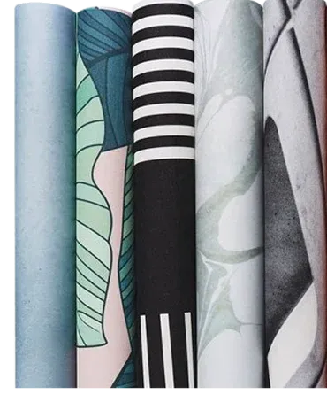 collection of stylish wallpaper rolls featuring various colors and patterns